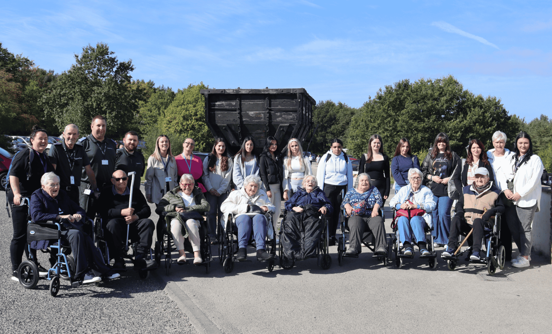 Group Photo of staff from Dale Care and Perfect Care as well as staff from Supportive and New College Durham, students and service users outside of Beamish.