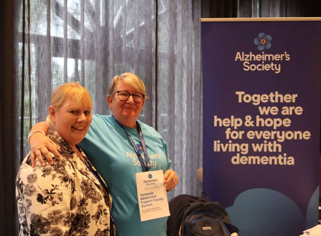 Carol Jackson, from Dale Care and Perfect Care smiling next to a worker from Alzheimer's Society.